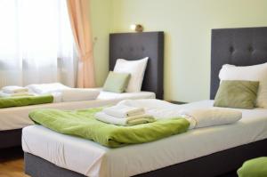 
Łóżko lub łóżka w pokoju w obiekcie WenderEDU Business Center
