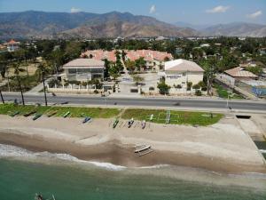 an aerial view of a beach and the ocean at Beach Garden Hotel in Dili