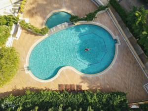 an overhead view of a large swimming pool at Wake Up Aonang Hotel- SHA EXTRA PLUS in Ao Nang Beach
