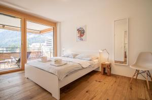 Postel nebo postele na pokoji v ubytování PlantA rosa by Arosa Holiday