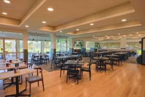 a large dining room with tables and chairs at Big River Golf & Country Club in Berri