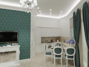 a kitchen with a table and chairs and a chandelier at Apart hotel Greenwood near Sea in Odesa