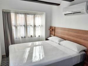 Postel nebo postele na pokoji v ubytování Hotel 19-30 Valencia