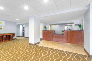 a large lobby with a reception desk in a building at Days Inn by Wyndham Blairsville in Blairsville