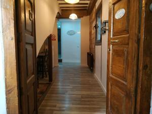 a door leading to a room with a wooden floor at El Patio de San Nicolas in Logroño