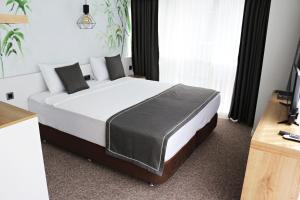 Ein Bett oder Betten in einem Zimmer der Unterkunft Luis Otel