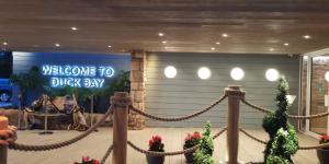 a welcome to duck bay sign in a room with a rope at Duck Bay Hotel & Restaurant in Balloch