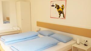 Postel nebo postele na pokoji v ubytování Manzoni Rooms