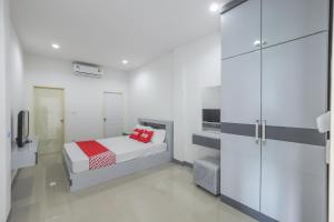 מיטה או מיטות בחדר ב-OYO 1159 K&k Apartment