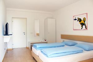 Postel nebo postele na pokoji v ubytování Manzoni Rooms