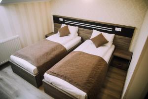 
A bed or beds in a room at Bolero plus
