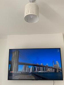 a tv screen with a picture of a bridge at Dane Guest House Free Parking Fast WiFi Modern Living in Burnley