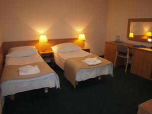 Letto o letti in una camera di Hotel Olimpijski