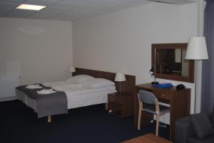 Letto o letti in una camera di Hotel Olimpijski