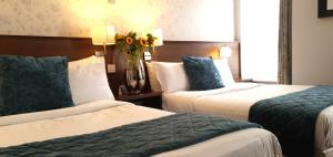 Кровать или кровати в номере The Gate Hotel