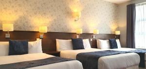 Letto o letti in una camera di The Gate Hotel