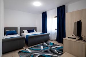 Postel nebo postele na pokoji v ubytování Simona Apartaments