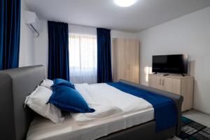 Postel nebo postele na pokoji v ubytování Simona Apartaments