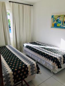 Krevet ili kreveti u jedinici u objektu Condomínio Mandakaru Residence 12