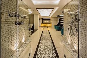 a hallway with a tile floor in a building at Esin Hotel in Denizli +38 photos