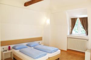 Postel nebo postele na pokoji v ubytování Manzoni Rooms