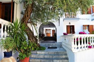 a house with a staircase leading to the front door at AKANTHUS STUDIOS - Ex Vergos Pavlos in Parga