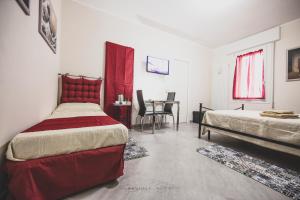A bed or beds in a room at ART & BOOKS bed and breakfast