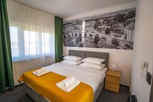 Postel nebo postele na pokoji v ubytování KM therooms BJELOVAR