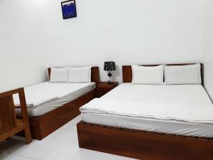 Postel nebo postele na pokoji v ubytování hotel đăng khôi 2 + 37 fotografií