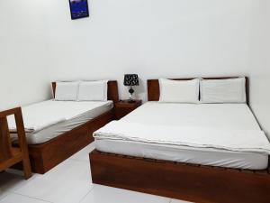 Postel nebo postele na pokoji v ubytování hotel đăng khôi 2