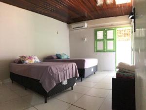 Postel nebo postele na pokoji v ubytování Casa praia Peito de Moça Luís Correia