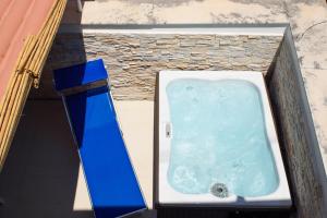 a blue and white bath tub in a building at Amalfi Suite Boutique Hotel in Amalfi