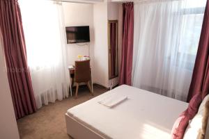 Postel nebo postele na pokoji v ubytování Hotel Bordeaux