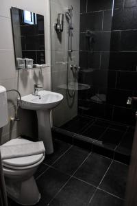Koupelna v ubytování Hotel Bordeaux