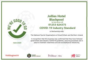 Un certificado, premio, letrero u otro documento en Jollies Hotel