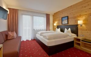 Voodi või voodid majutusasutuse Hotel Tipotsch toas
