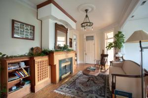 a living room with a fireplace and a couch at Ellerbeck Bed & Breakfast in Salt Lake City