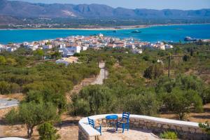 a view of a town and the water at Studios Maniati in Elafonisos