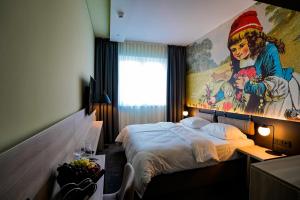 Postel nebo postele na pokoji v ubytování Hotel Viktorosa