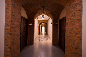 an alley way with a brick wall and a light at Hotel Santa Rosa by Rotamundos in Cholula