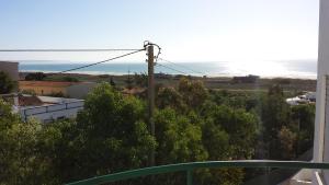 a view of the ocean from the balcony of a house at Clube Meia Praia in Lagos