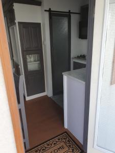 a door leading into a kitchen with a counter at Devachan Apartments in Bridgetown +38 photos