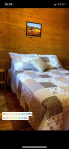Katil atau katil-katil dalam bilik di Pousada Chales Aconchego Serrano