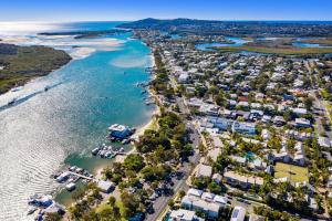 an aerial view of a harbor with boats in the water at The Islander Noosa Resort in Noosaville