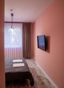 TV a/nebo společenská místnost v ubytování Hi hotel