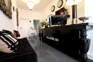 a living room with a couch and a fireplace at VILLA ADELEes BOUTIQUE HOTEL in Alsfeld
