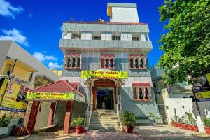 a building with a sign in front of it at The K11 Hotels - T Nagar in Chennai