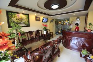 a woman standing at a bar in a salon at The Art - Tuan Viet Hotel in Ho Chi Minh City