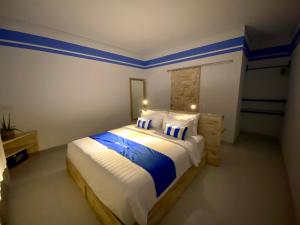 Postel nebo postele na pokoji v ubytování Kura Kura Divers Lodge