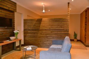 a living room with a large wooden wall at La Perle in Ballito